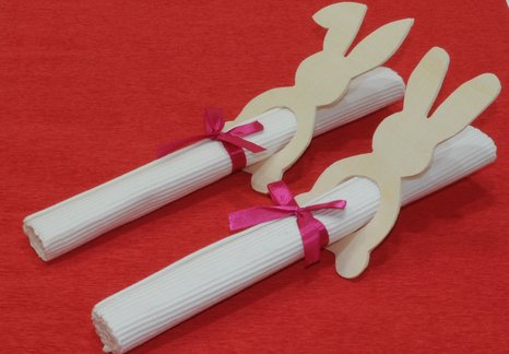 Easter bunny napkin holder on a red cloth